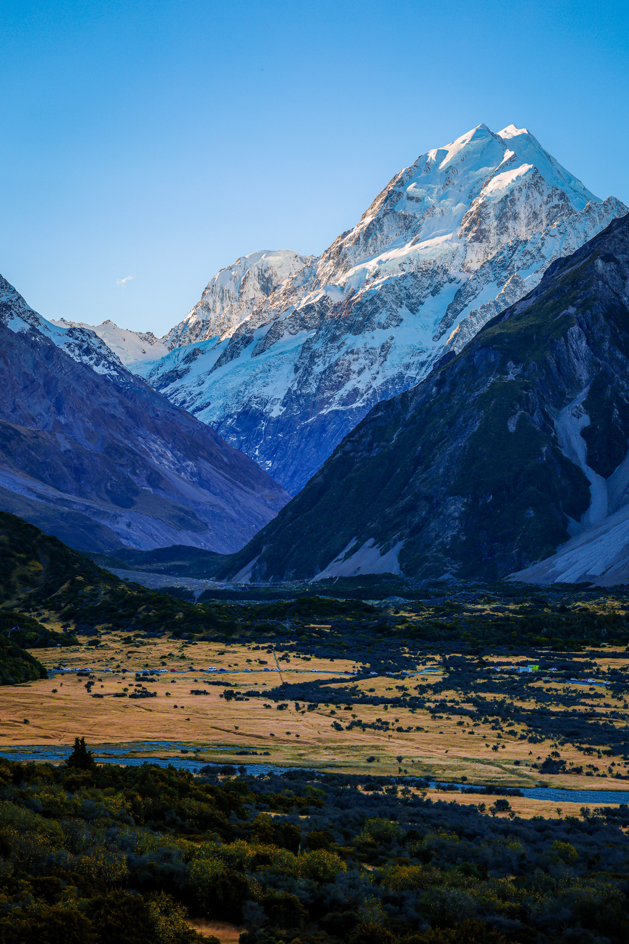 A snow peak above a glacial valley